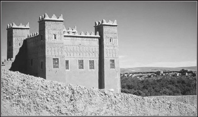 This fortress in central Morocco was built on a hillside overlooking the valley below. It includes square towers and an ornamental roofline, features common to many other North African buildings