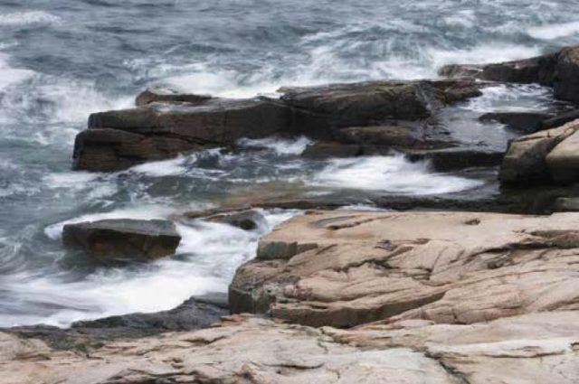 Waves break on the coast of Maine